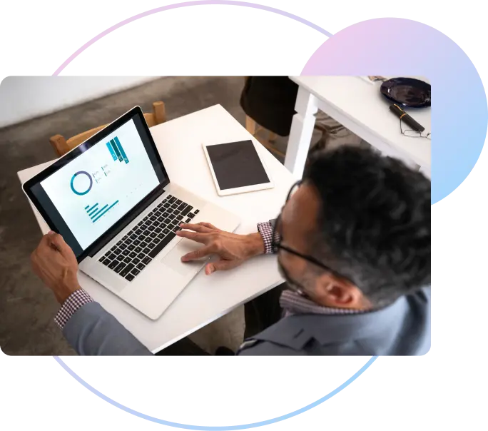 Professional reviewing compensation analytics on a laptop
