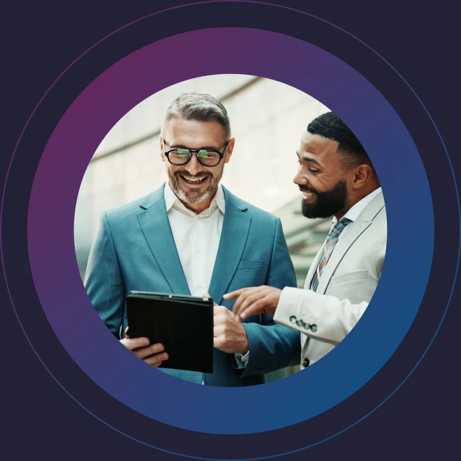 Two business professionals reviewing information together on a tablet